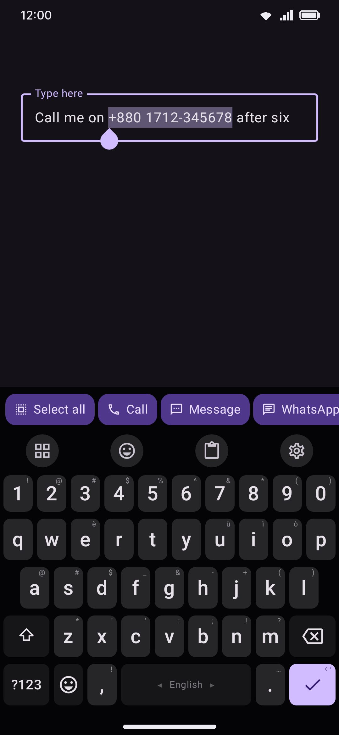 A selected phone number, and the bar the keyboard offers for it.