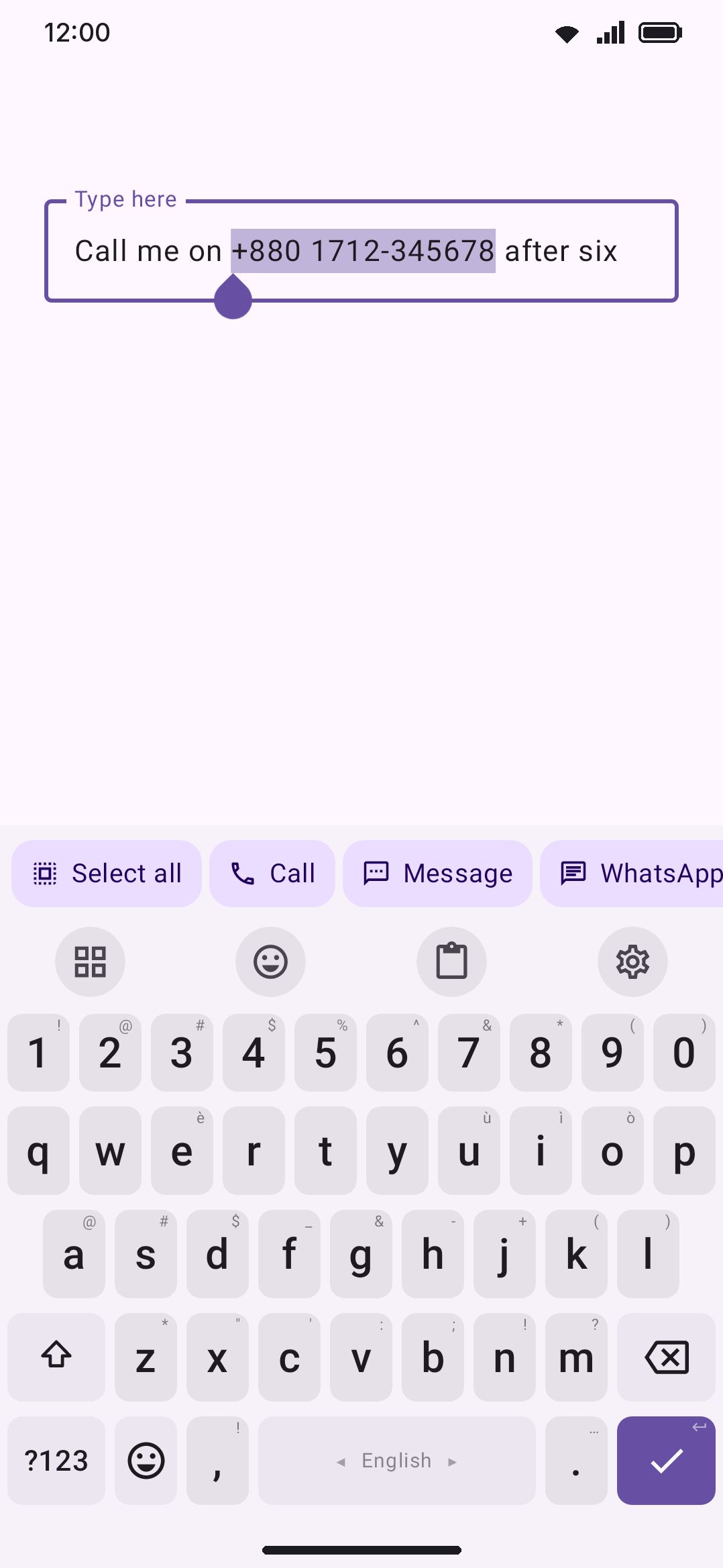 A selected phone number, and the bar the keyboard offers for it.